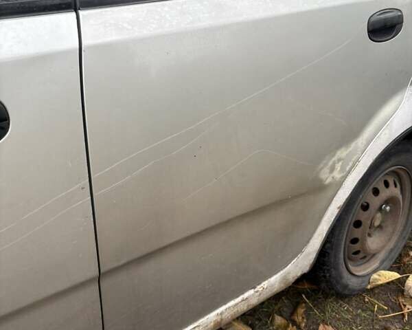 Серый Шевроле Авео, объемом двигателя 1.4 л и пробегом 270 тыс. км за 2000 $, фото 2 на Automoto.ua