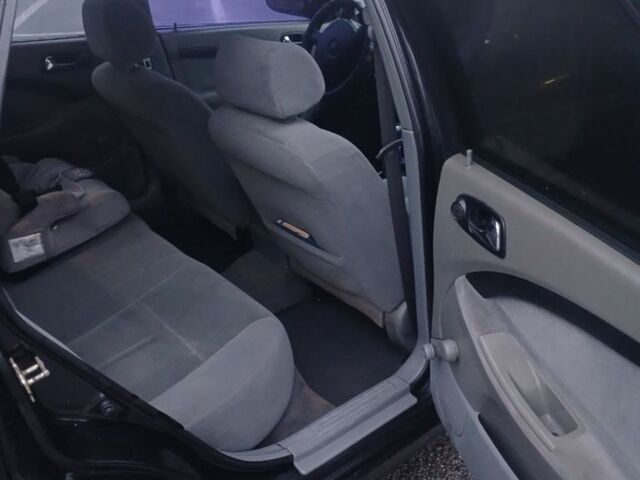 Чорний Шевроле Чєвєттє, об'ємом двигуна 1.8 л та пробігом 210 тис. км за 4590 $, фото 7 на Automoto.ua