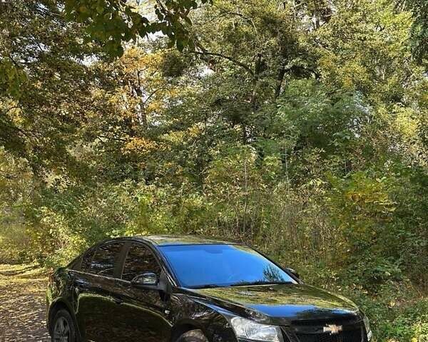 Черный Шевроле Круз, объемом двигателя 1.8 л и пробегом 177 тыс. км за 6400 $, фото 1 на Automoto.ua