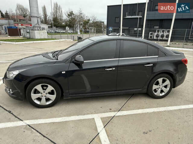 Черный Шевроле Круз, объемом двигателя 1.8 л и пробегом 141 тыс. км за 7700 $, фото 1 на Automoto.ua