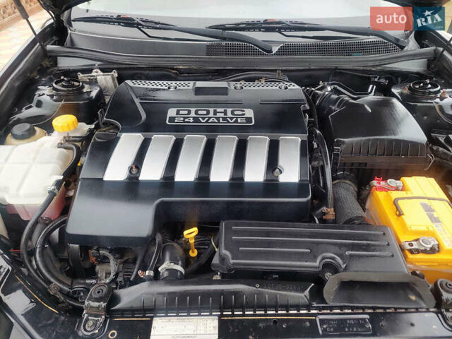 Черный Шевроле Эпика, объемом двигателя 1.99 л и пробегом 205 тыс. км за 3750 $, фото 10 на Automoto.ua