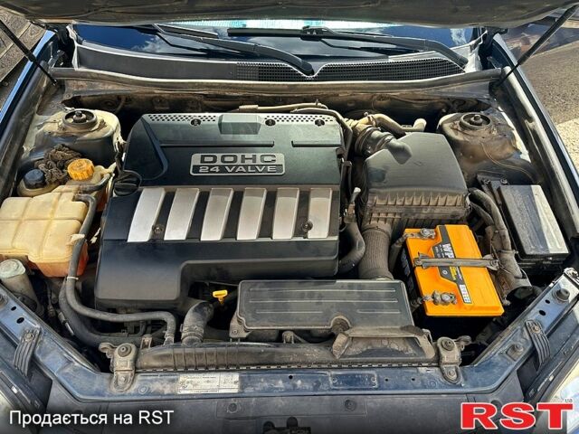 Синій Шевроле Епіка, об'ємом двигуна 2 л та пробігом 236 тис. км за 5300 $, фото 5 на Automoto.ua