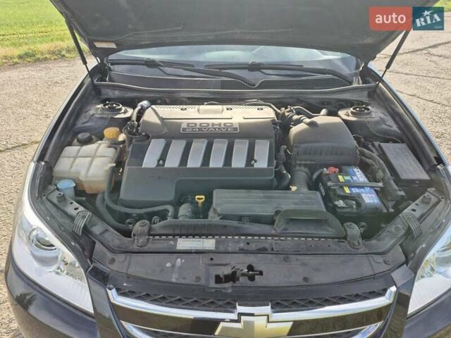 Зеленый Шевроле Эпика, объемом двигателя 2 л и пробегом 51 тыс. км за 7500 $, фото 9 на Automoto.ua