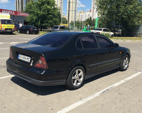 Черный Шевроле Эванда, объемом двигателя 2 л и пробегом 225 тыс. км за 3000 $, фото 2 на Automoto.ua