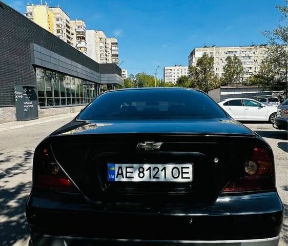 Черный Шевроле Эванда, объемом двигателя 2 л и пробегом 311 тыс. км за 4500 $, фото 2 на Automoto.ua