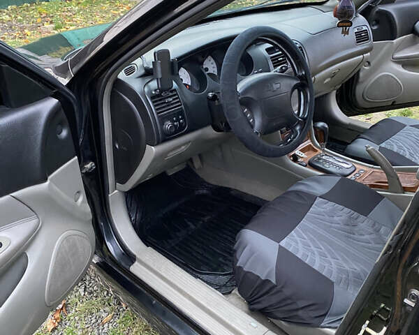 Чорний Шевроле Еванда, об'ємом двигуна 2 л та пробігом 181 тис. км за 5000 $, фото 10 на Automoto.ua