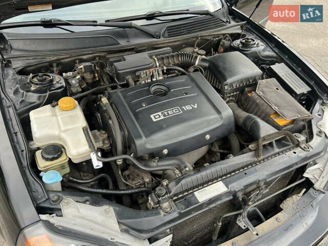 Черный Шевроле Эванда, объемом двигателя 2 л и пробегом 193 тыс. км за 4200 $, фото 28 на Automoto.ua