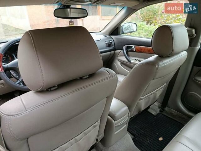 Черный Шевроле Эванда, объемом двигателя 2 л и пробегом 207 тыс. км за 4436 $, фото 7 на Automoto.ua