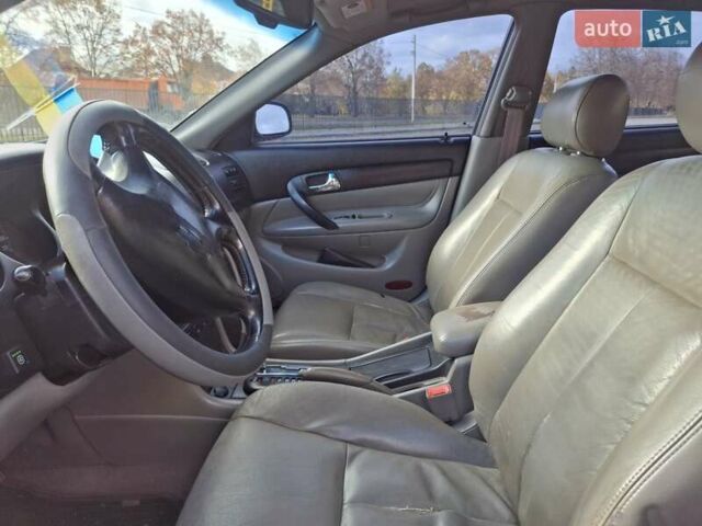 Чорний Шевроле Еванда, об'ємом двигуна 2 л та пробігом 280 тис. км за 3899 $, фото 2 на Automoto.ua