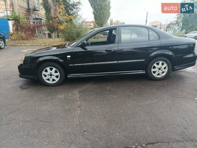 Чорний Шевроле Еванда, об'ємом двигуна 2 л та пробігом 355 тис. км за 3500 $, фото 8 на Automoto.ua
