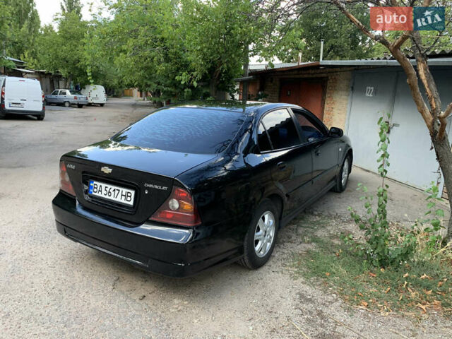 Черный Шевроле Эванда, объемом двигателя 2.5 л и пробегом 187 тыс. км за 4700 $, фото 1 на Automoto.ua