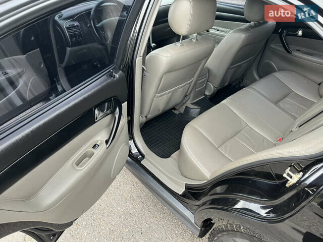 Черный Шевроле Эванда, объемом двигателя 2 л и пробегом 193 тыс. км за 4200 $, фото 11 на Automoto.ua