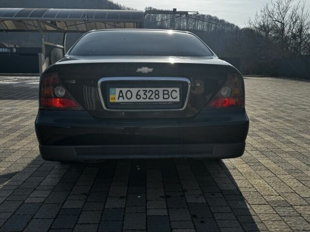 Черный Шевроле Эванда, объемом двигателя 2 л и пробегом 252 тыс. км за 2800 $, фото 3 на Automoto.ua