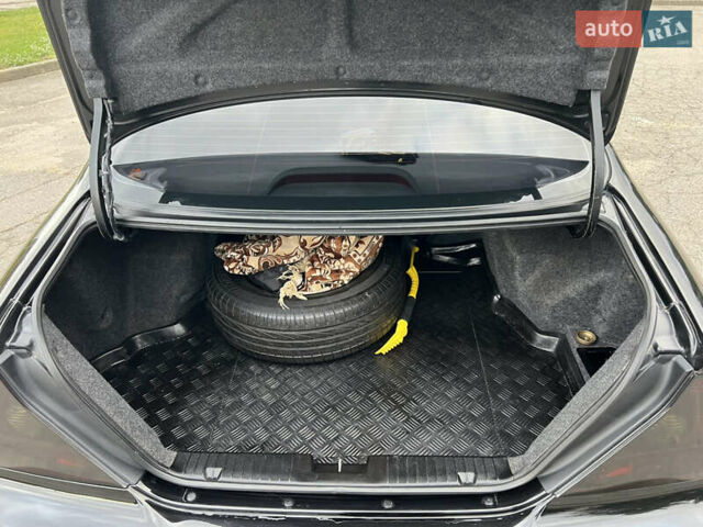 Черный Шевроле Эванда, объемом двигателя 2 л и пробегом 193 тыс. км за 4200 $, фото 20 на Automoto.ua