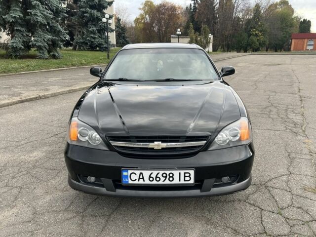 Черный Шевроле Эванда, объемом двигателя 2 л и пробегом 193 тыс. км за 4200 $, фото 8 на Automoto.ua