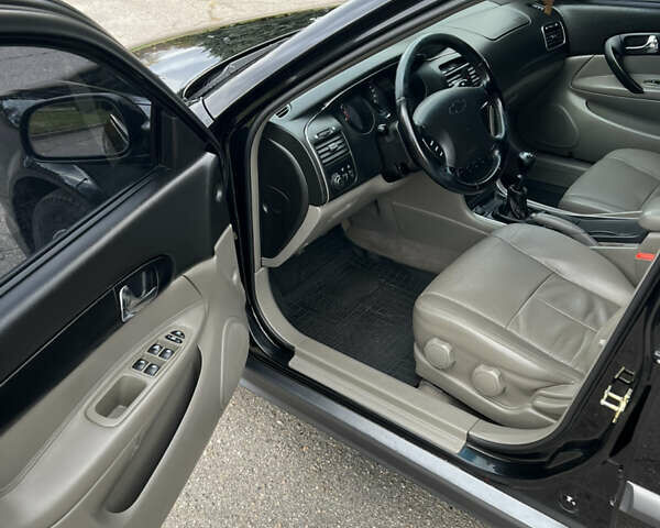 Черный Шевроле Эванда, объемом двигателя 2 л и пробегом 193 тыс. км за 4200 $, фото 9 на Automoto.ua