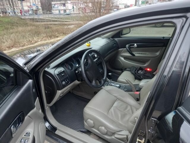 Черный Шевроле Эванда, объемом двигателя 2 л и пробегом 198 тыс. км за 4500 $, фото 4 на Automoto.ua