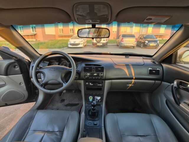 Черный Шевроле Эванда, объемом двигателя 2 л и пробегом 250 тыс. км за 4196 $, фото 8 на Automoto.ua