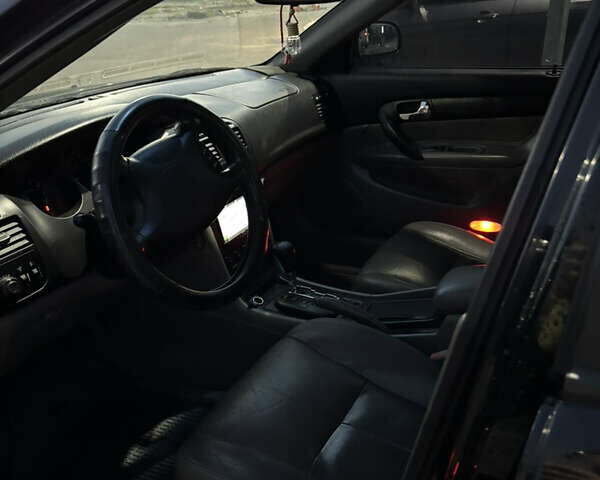 Черный Шевроле Эванда, объемом двигателя 2 л и пробегом 245 тыс. км за 3650 $, фото 8 на Automoto.ua