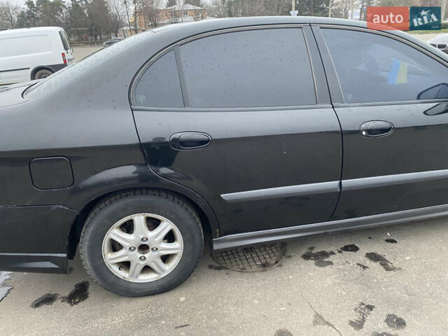 Чорний Шевроле Еванда, об'ємом двигуна 2 л та пробігом 235 тис. км за 3500 $, фото 46 на Automoto.ua