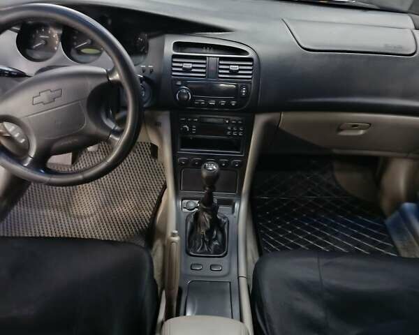 Чорний Шевроле Еванда, об'ємом двигуна 2 л та пробігом 355 тис. км за 3500 $, фото 2 на Automoto.ua