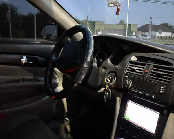 Черный Шевроле Эванда, объемом двигателя 2 л и пробегом 245 тыс. км за 3650 $, фото 11 на Automoto.ua