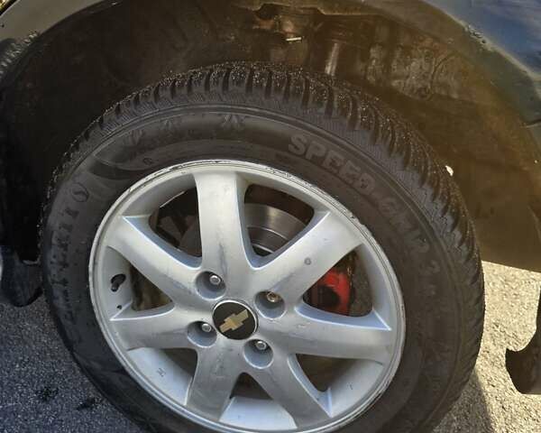 Чорний Шевроле Еванда, об'ємом двигуна 2 л та пробігом 290 тис. км за 2850 $, фото 15 на Automoto.ua