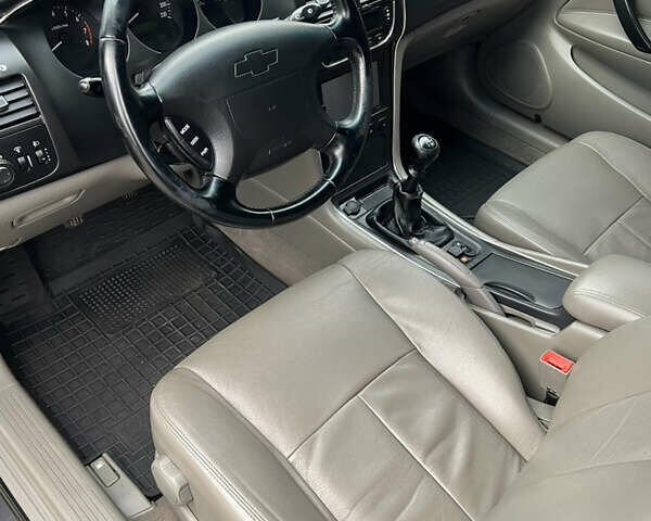 Черный Шевроле Эванда, объемом двигателя 2 л и пробегом 193 тыс. км за 4200 $, фото 10 на Automoto.ua