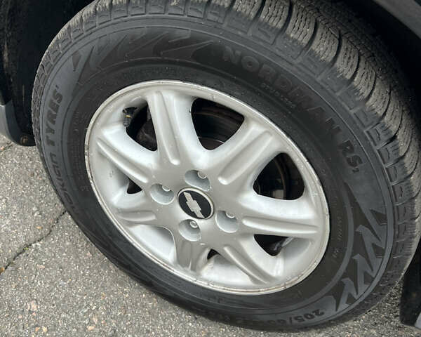 Черный Шевроле Эванда, объемом двигателя 2 л и пробегом 193 тыс. км за 4200 $, фото 30 на Automoto.ua