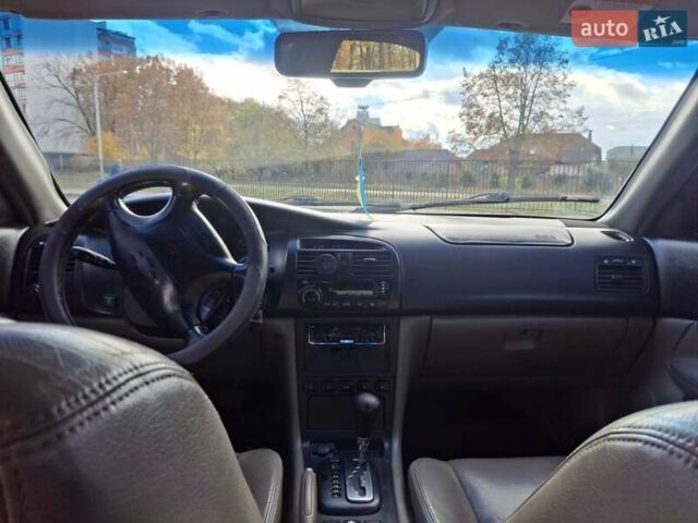 Чорний Шевроле Еванда, об'ємом двигуна 2 л та пробігом 280 тис. км за 3899 $, фото 5 на Automoto.ua