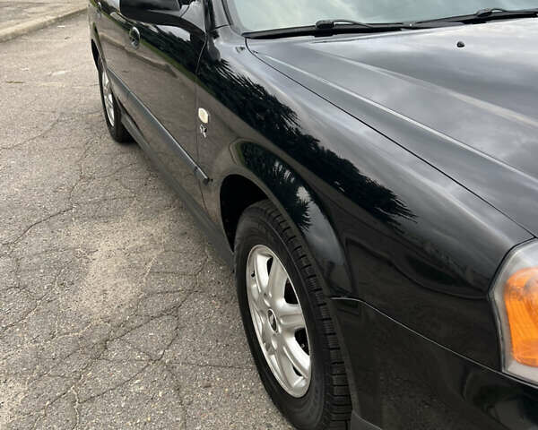 Черный Шевроле Эванда, объемом двигателя 2 л и пробегом 193 тыс. км за 4200 $, фото 27 на Automoto.ua