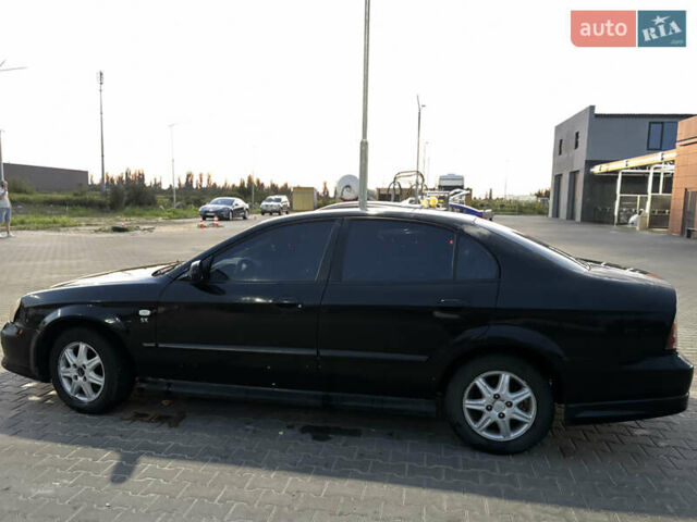 Черный Шевроле Эванда, объемом двигателя 2 л и пробегом 245 тыс. км за 3650 $, фото 1 на Automoto.ua