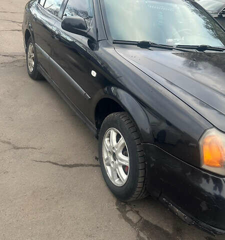 Чорний Шевроле Еванда, об'ємом двигуна 2 л та пробігом 266 тис. км за 3000 $, фото 2 на Automoto.ua