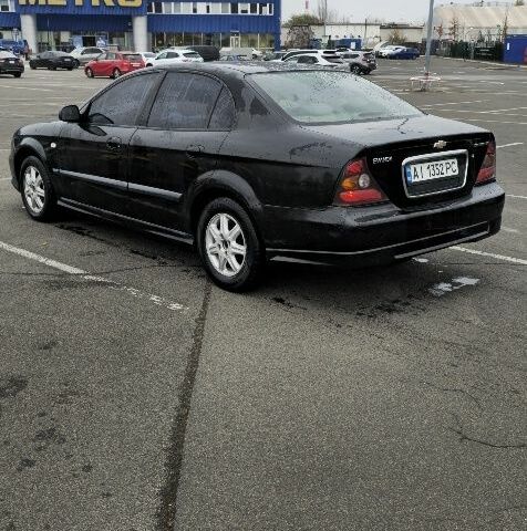 Черный Шевроле Эванда, объемом двигателя 2 л и пробегом 350 тыс. км за 3400 $, фото 2 на Automoto.ua