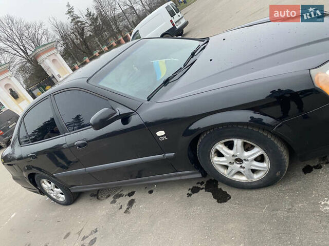 Чорний Шевроле Еванда, об'ємом двигуна 2 л та пробігом 235 тис. км за 3500 $, фото 48 на Automoto.ua
