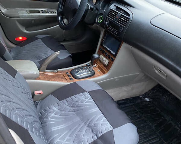 Чорний Шевроле Еванда, об'ємом двигуна 2 л та пробігом 181 тис. км за 5000 $, фото 12 на Automoto.ua