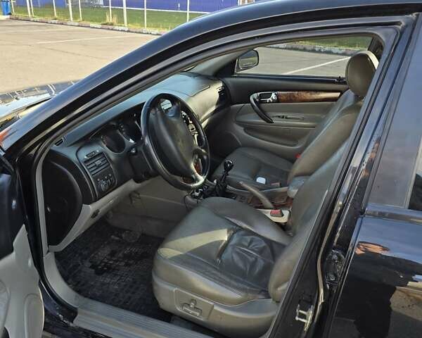 Чорний Шевроле Еванда, об'ємом двигуна 2 л та пробігом 290 тис. км за 2850 $, фото 10 на Automoto.ua