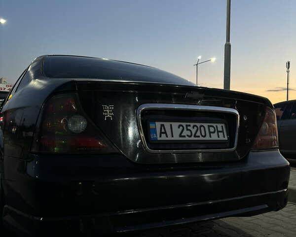 Черный Шевроле Эванда, объемом двигателя 2 л и пробегом 245 тыс. км за 3650 $, фото 3 на Automoto.ua