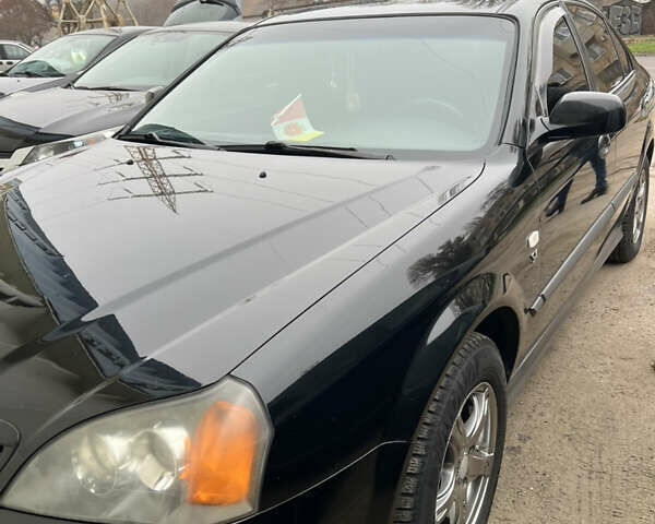 Чорний Шевроле Еванда, об'ємом двигуна 2 л та пробігом 260 тис. км за 5100 $, фото 8 на Automoto.ua