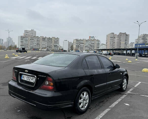 Чорний Шевроле Еванда, об'ємом двигуна 2 л та пробігом 299 тис. км за 3500 $, фото 3 на Automoto.ua