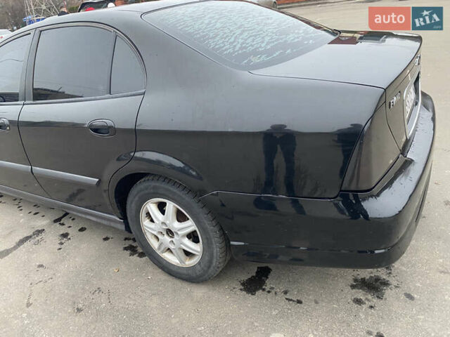Чорний Шевроле Еванда, об'ємом двигуна 2 л та пробігом 235 тис. км за 3500 $, фото 43 на Automoto.ua