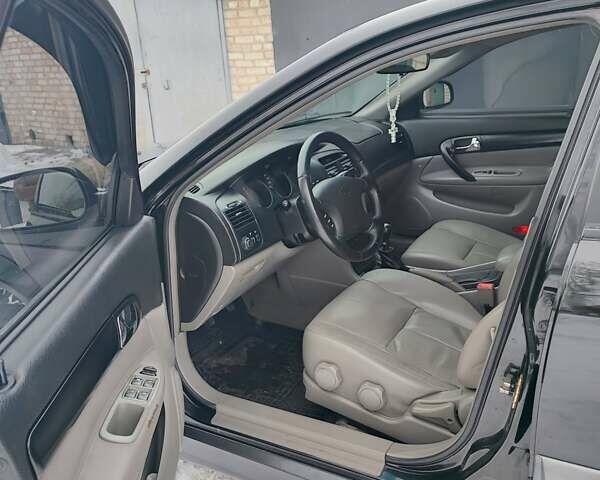 Черный Шевроле Эванда, объемом двигателя 2 л и пробегом 197 тыс. км за 5200 $, фото 39 на Automoto.ua