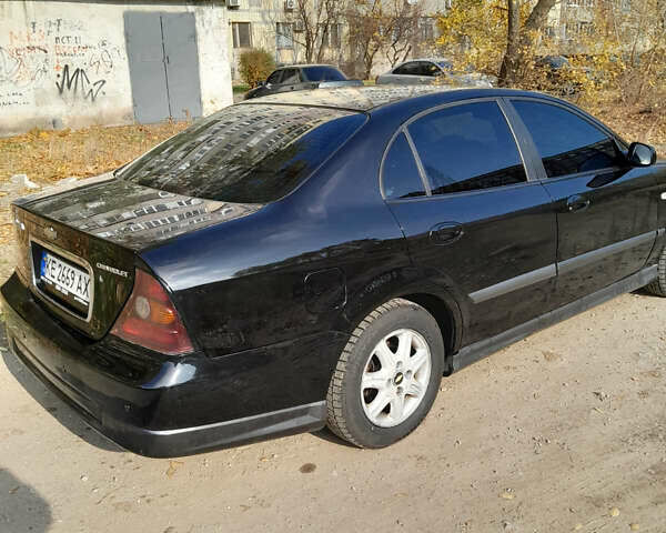 Черный Шевроле Эванда, объемом двигателя 2 л и пробегом 260 тыс. км за 4150 $, фото 12 на Automoto.ua