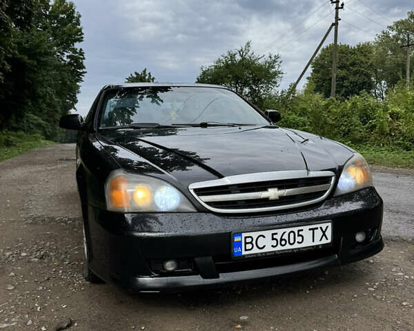 Черный Шевроле Эванда, объемом двигателя 2 л и пробегом 280 тыс. км за 3000 $, фото 1 на Automoto.ua