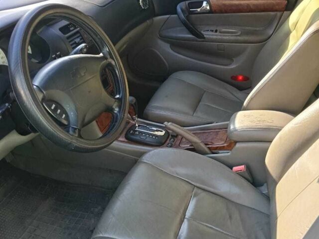 Черный Шевроле Эванда, объемом двигателя 2.5 л и пробегом 215 тыс. км за 3114 $, фото 10 на Automoto.ua