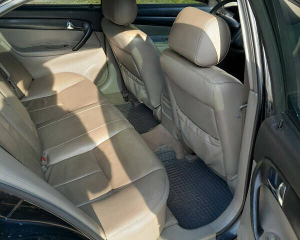 Черный Шевроле Эванда, объемом двигателя 2 л и пробегом 260 тыс. км за 4150 $, фото 5 на Automoto.ua