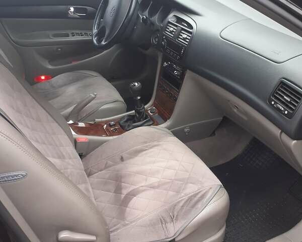 Черный Шевроле Эванда, объемом двигателя 2 л и пробегом 200 тыс. км за 3800 $, фото 1 на Automoto.ua