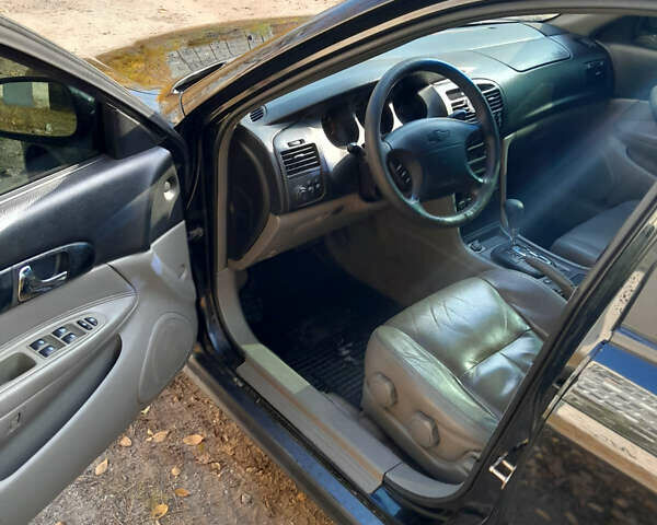 Черный Шевроле Эванда, объемом двигателя 2 л и пробегом 260 тыс. км за 4150 $, фото 7 на Automoto.ua