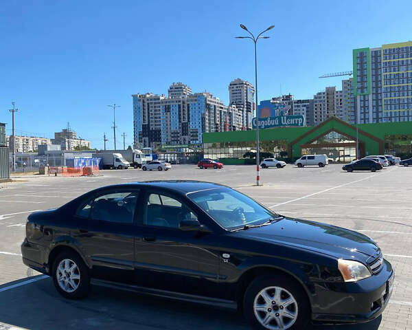 Черный Шевроле Эванда, объемом двигателя 2 л и пробегом 266 тыс. км за 3600 $, фото 2 на Automoto.ua