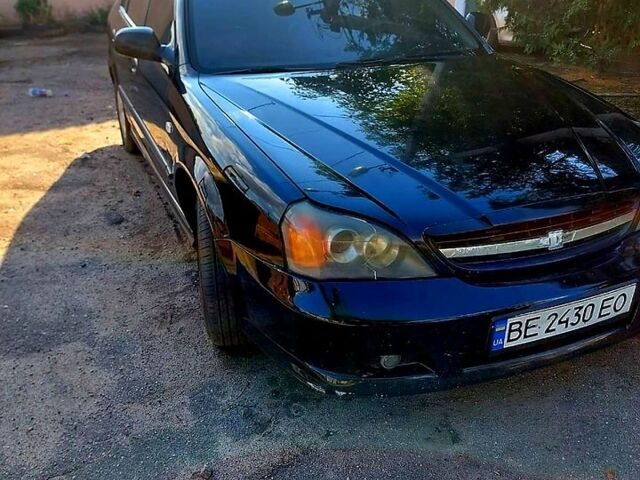 Черный Шевроле Эванда, объемом двигателя 2.5 л и пробегом 142 тыс. км за 4000 $, фото 2 на Automoto.ua